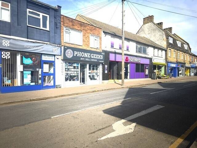 High Street Mixed Use Commercial Property with Shop and 2 Bedroom Flat in Wickford Photo 1