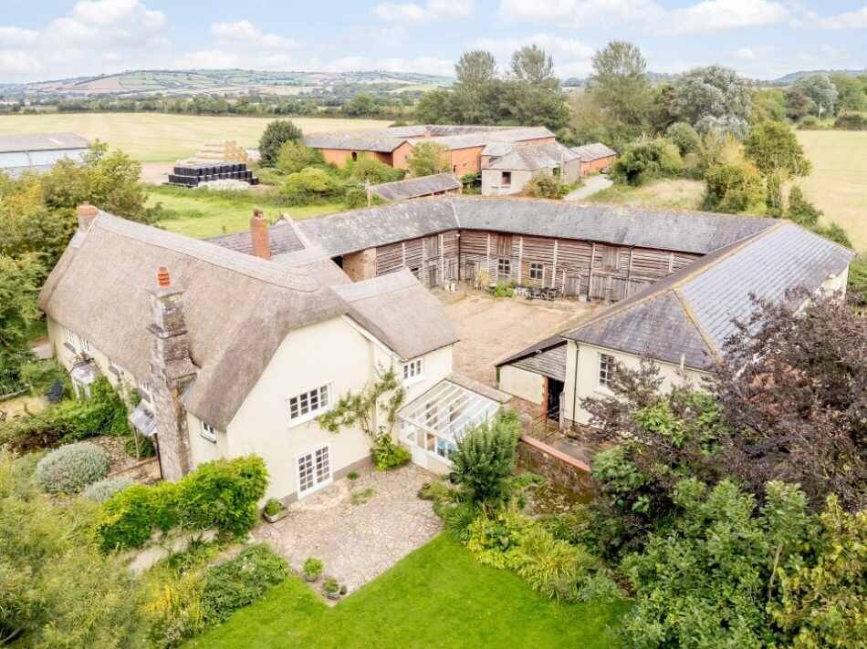 Charming 4BR Farmhouse and 3 Cottages in Tranquil Exeter Devon for Sale Photo 1