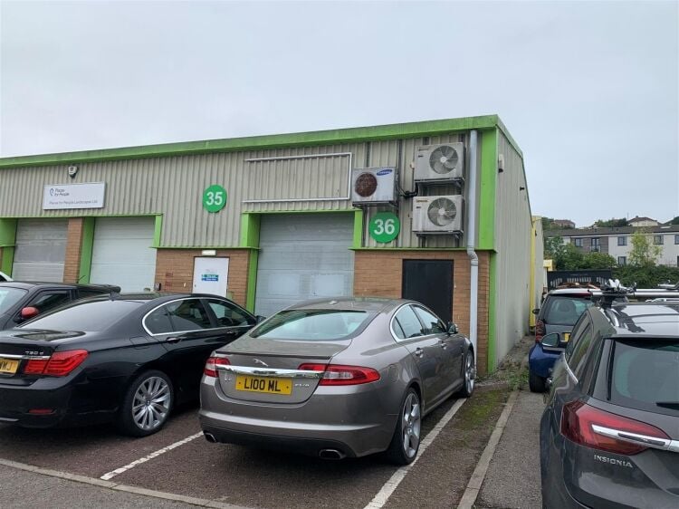 An end of terrace two storey workshop/office of approximately 1,014 ft² (94m²) with roller shutter access and off street parking to the fron Photo 1