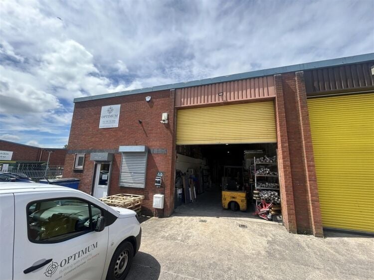 A modern industrial unit of approx 2,994 ft². the ground floor is arranged as a unit with roller shutter access with reception/office, kitchen a Photo 1