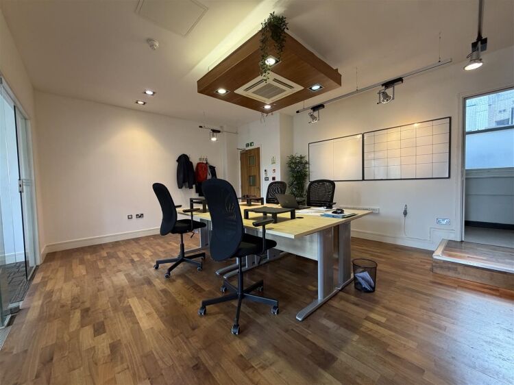 A well presented office suite extending to approximately 511 sq ft, thoughtfully arranged to provide a spacious open plan working area with the benefi Photo 10