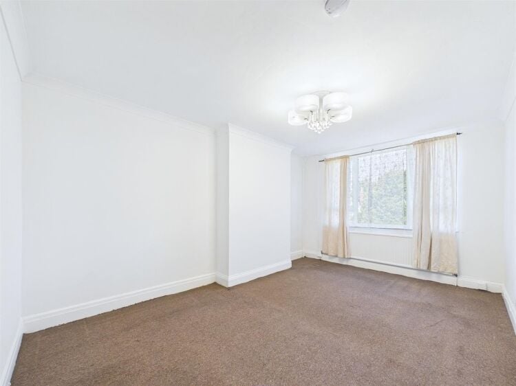 A large mixed-use investment property arranged as a ground floor shop (of approx. 740 ft²) with a large and self contained 2 bedroom flat above a Photo 10