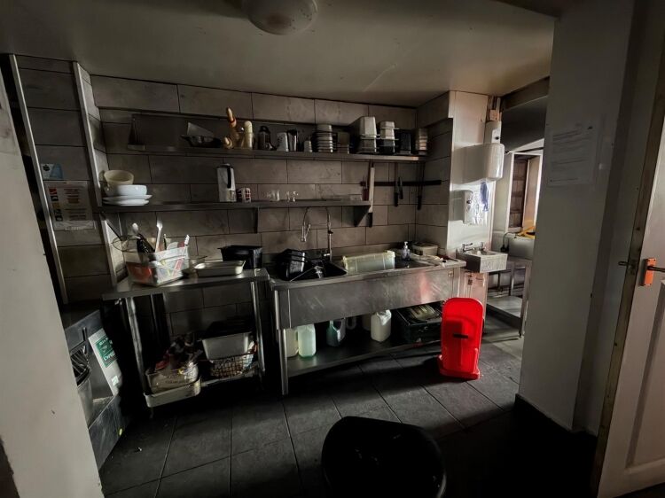 A mid terrace takeaway, of approximately 600 ft², with commercial extraction and additional first floor ancillary storage (of approx. 350 ft² Photo 10