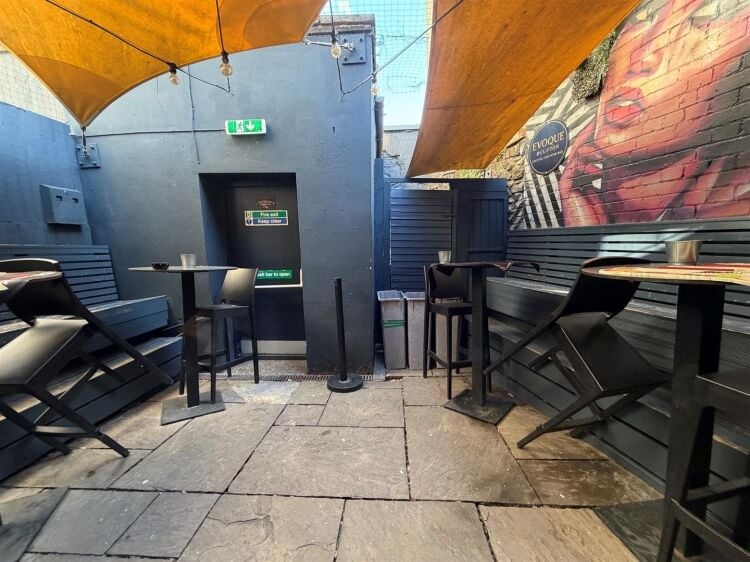 A fully fitted bar of approximately 1,035 ft² with additional basement stores and toilets, and an enclosed rear courtyard garden. the unit was pr Photo 11