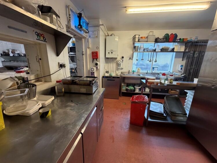 A fully fitted restaurant/bar extending to approximately 1,580 ft² benefiting from a fully equipped commercial kitchen, enclosed rear garden, and Photo 12