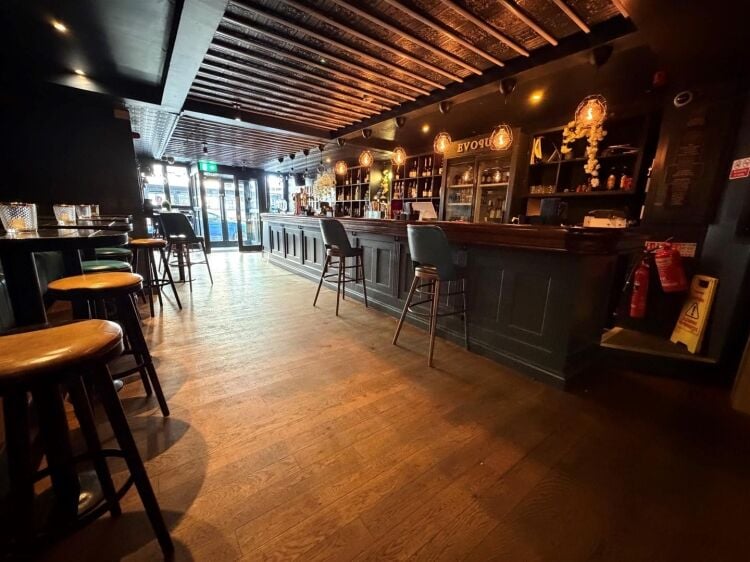 A fully fitted bar of approximately 1,035 ft² with additional basement stores and toilets, and an enclosed rear courtyard garden. the unit was pr Photo 13