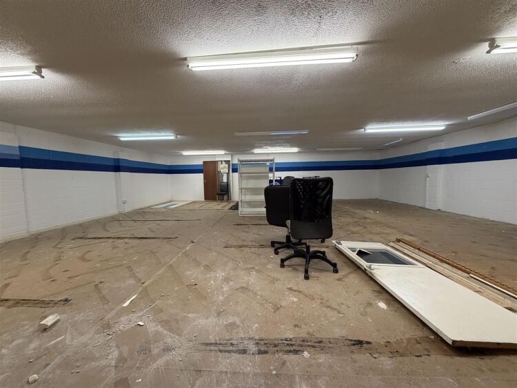 The property comprises a substantial retail unit extending to approximately 4,912 sq ft, arranged over ground and first floors. Photo 13