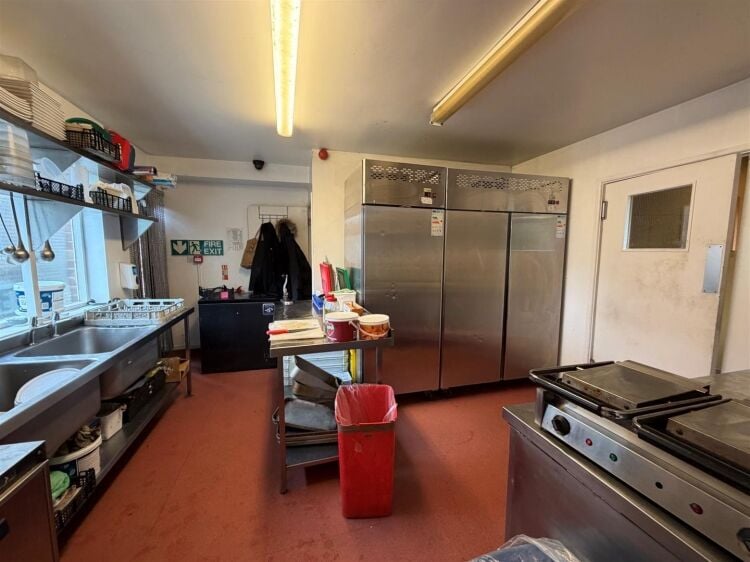 A fully fitted restaurant/bar extending to approximately 1,580 ft² benefiting from a fully equipped commercial kitchen, enclosed rear garden, and Photo 15