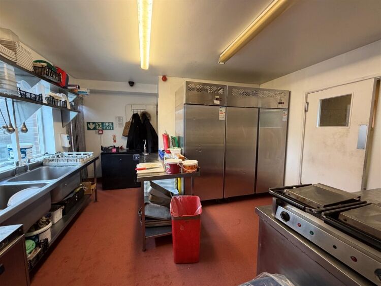 A fully fitted restaurant/bar extending to approximately 1,580 ft² benefiting from a fully equipped commercial kitchen, enclosed rear garden, and Photo 15