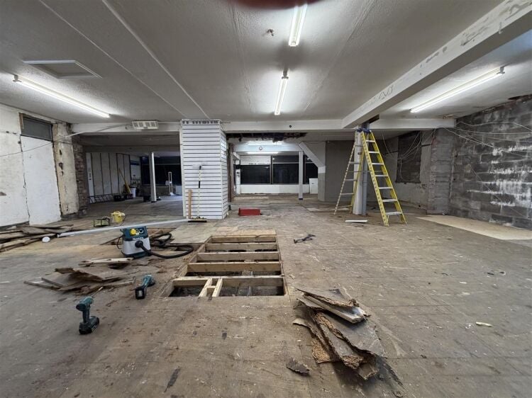 The property comprises a substantial retail unit extending to approximately 4,912 sq ft, arranged over ground and first floors. Photo 15