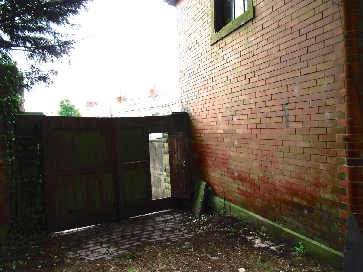 Renovation Ready Detached Property in Blackburn's Heart Photo 2