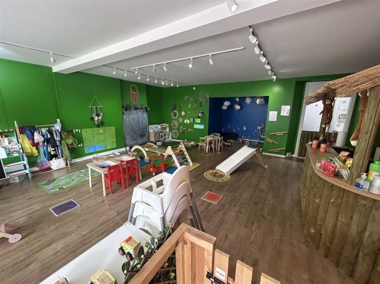 A ground floor retail unit of approximately 690 ft² arranged as an open plan shop area with rear storage, kitchenette and wc. Photo 2