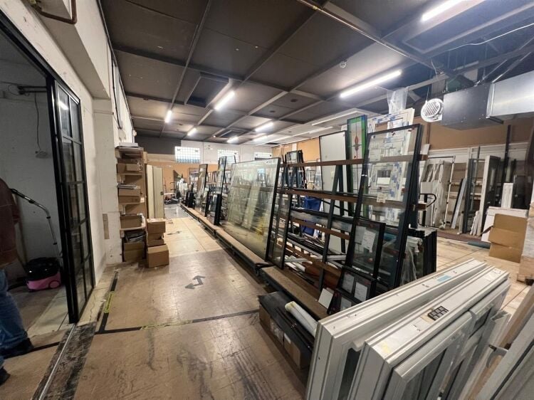 A large showroom of approximately 5,340 ft² with forecourt parking and a large, enclosed yard to the rear. the unit is situated in mangotsfield, Photo 2
