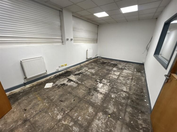 A ground floor office of approx 1,500 ft² with additional toilet facilities. the property benefits from allocated parking, security shutters, and Photo 2