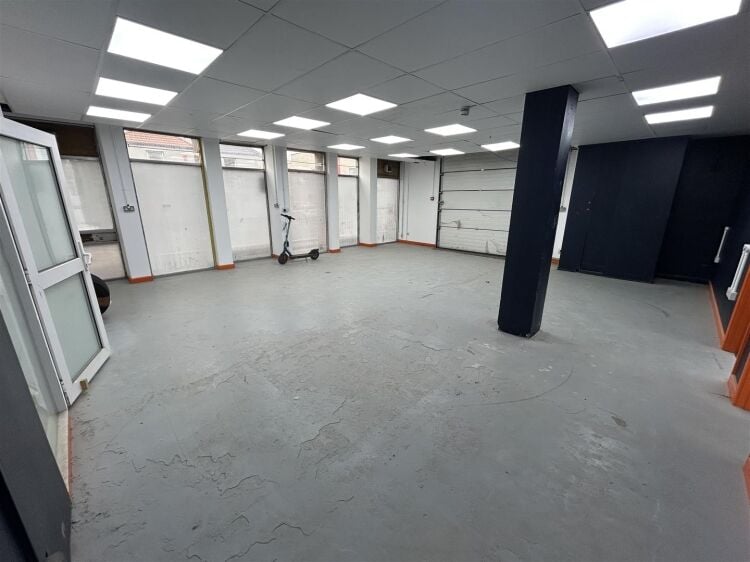 Ground floor industrial unit/workshop of approximately 1,256 sq ft arranged as open plan workspace with adjoining storage and workshop space. the unit Photo 2