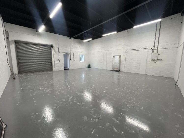 Light industrial unit extending to approximately 1,612 sq ft, configured to provide predominantly open plan workshop accommodation complemented by a s Photo 2