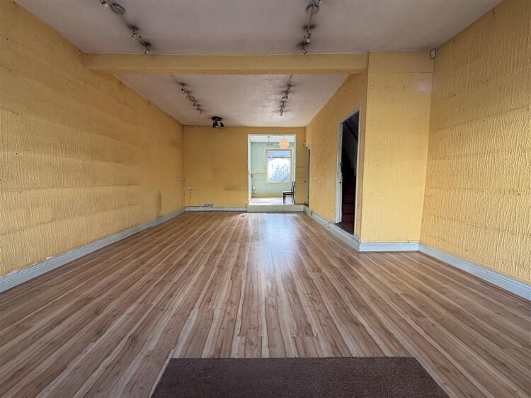 Retail unit extending to approximately 1,405 sq ft, arranged over ground, first, and basement levels. the ground floor offers an open plan retail area Photo 2