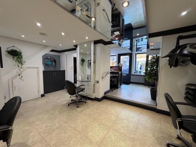 An extended two-storey retail premises located in the town centre, let to reflections hair salon at £32,000 per annum on a 10-year fully repairin Photo 2