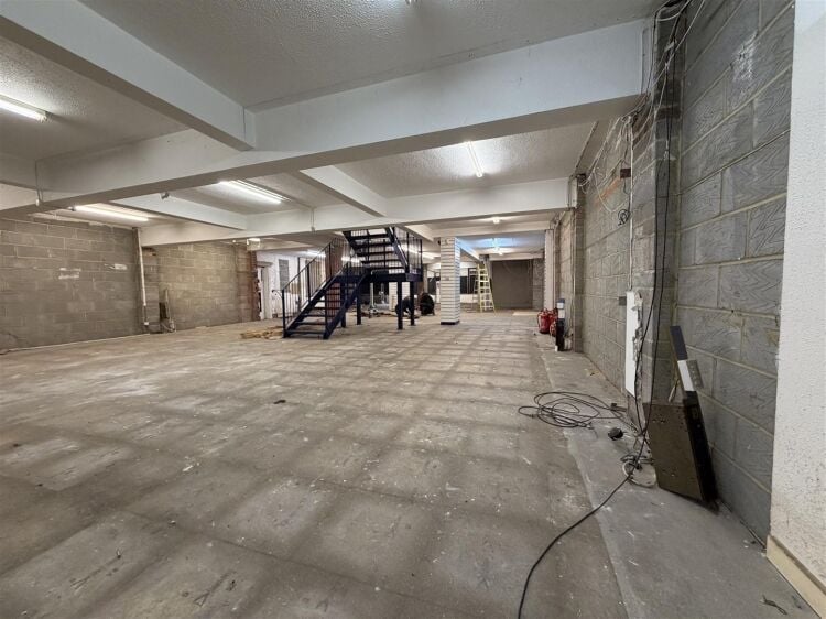 The property comprises a substantial retail unit extending to approximately 4,912 sq ft, arranged over ground and first floors. Photo 2
