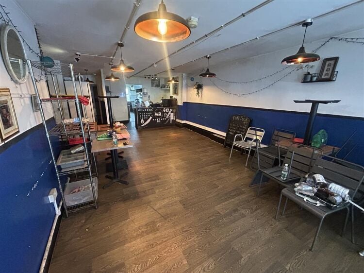 Ground floor restaurant/café of approximately 900 sq ft, with an additional basement level providing useful ancillary storage space. the property is Photo 2