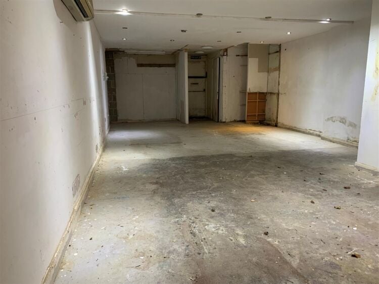 An end of terrace two storey workshop/office of approximately 1,014 ft² (94m²) with roller shutter access and off street parking to the fron Photo 3