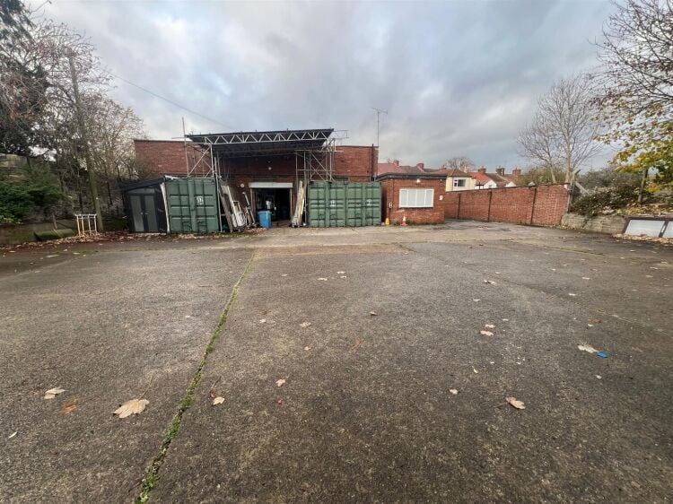 A large showroom of approximately 5,340 ft² with forecourt parking and a large, enclosed yard to the rear. the unit is situated in mangotsfield, Photo 3