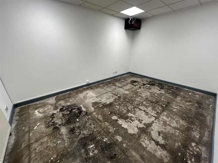 A ground floor office of approx 1,500 ft² with additional toilet facilities. the property benefits from allocated parking, security shutters, and Photo 3