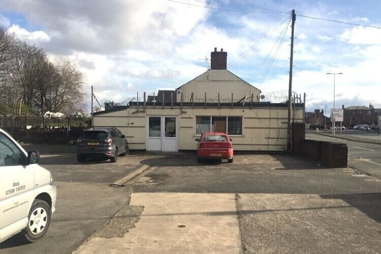 Prime Freehold Land in Flint Offering 1/3 Acre, Two Commercial Buildings, and Planning Permission Photo 3