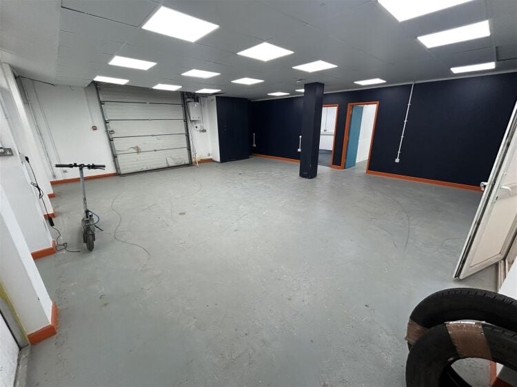 Ground floor industrial unit/workshop of approximately 1,256 sq ft arranged as open plan workspace with adjoining storage and workshop space. the unit Photo 3