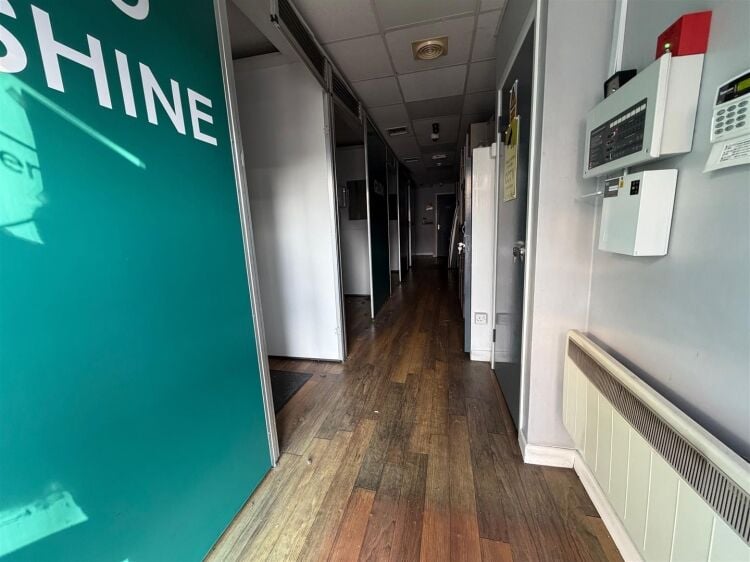 A ground floor retail unit extending to approximately 750 sq ft, most recently trading as a tanning salon. Photo 3