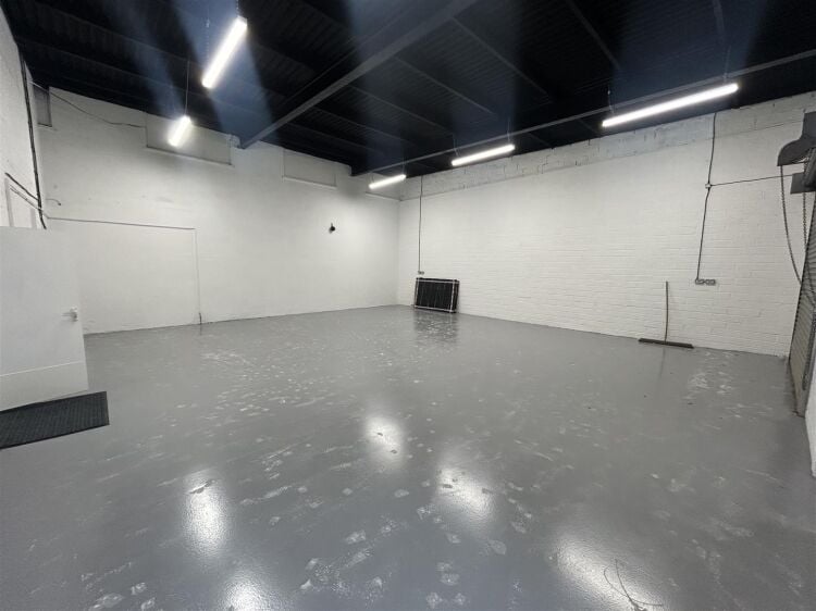 Light industrial unit extending to approximately 1,612 sq ft, configured to provide predominantly open plan workshop accommodation complemented by a s Photo 3