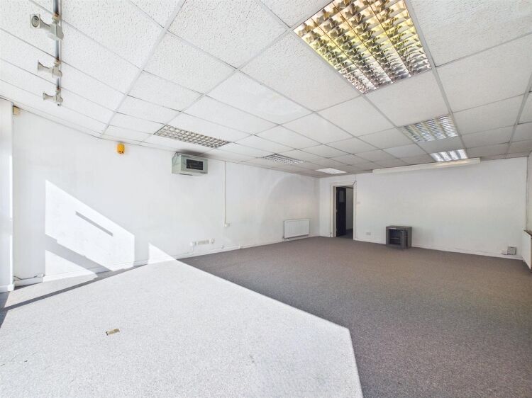 A large mixed-use investment property arranged as a ground floor shop (of approx. 740 ft²) with a large and self contained 2 bedroom flat above a Photo 3