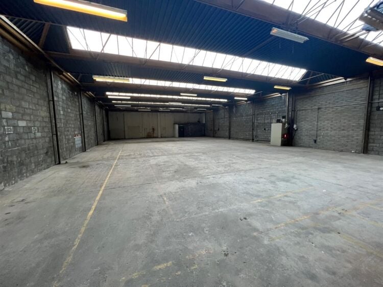 A well presented industrial unit of approximately 5,860 ft² arranged predominantly as a warehouse with ancillary offices/reception, male and fema Photo 3