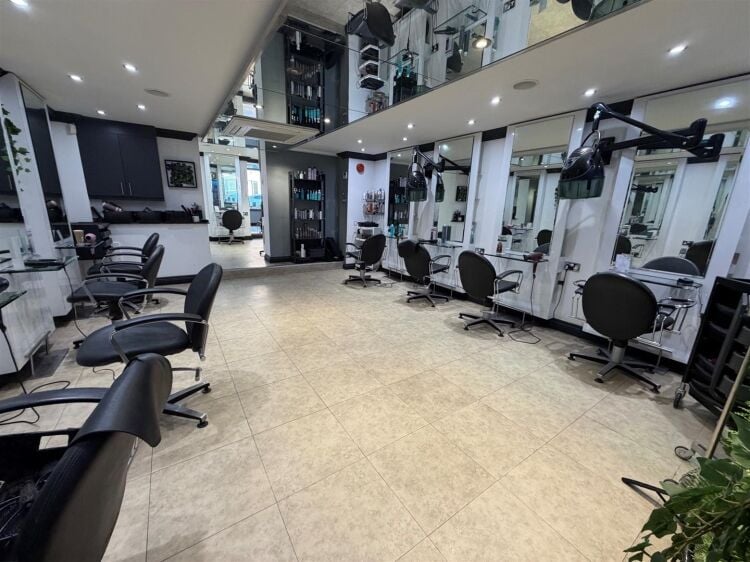 An extended two-storey retail premises located in the town centre, let to reflections hair salon at £32,000 per annum on a 10-year fully repairin Photo 3
