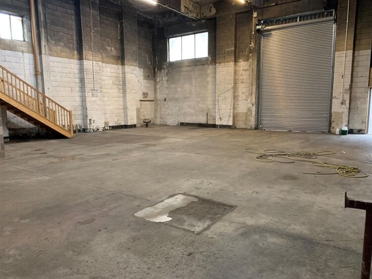 An industrial unit of approximately 2,500 ft² located within the printworks development which is currently undergoing significant redevelopment. Photo 3