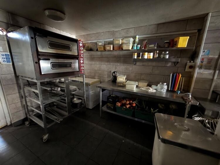 A mid terrace takeaway, of approximately 600 ft², with commercial extraction and additional first floor ancillary storage (of approx. 350 ft² Photo 3