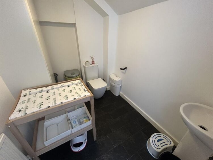 A ground floor retail unit of approximately 690 ft² arranged as an open plan shop area with rear storage, kitchenette and wc. Photo 4