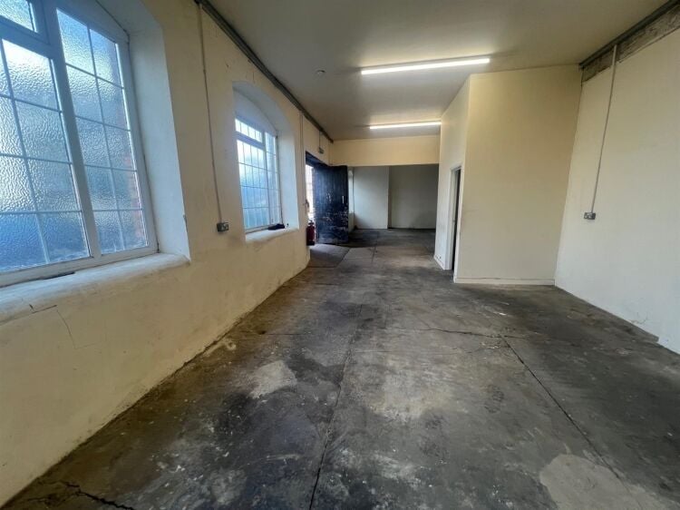 A ground floor workshop/store of approximately 760 ft² / 71m² with wc. the unit benefits from double doors and windows to the front. a furth Photo 4