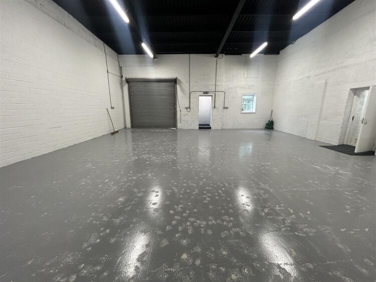 Light industrial unit extending to approximately 1,612 sq ft, configured to provide predominantly open plan workshop accommodation complemented by a s Photo 4