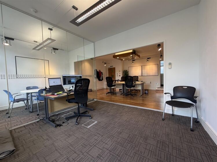 A well presented office suite extending to approximately 511 sq ft, thoughtfully arranged to provide a spacious open plan working area with the benefi Photo 4