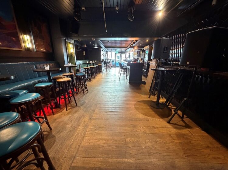 A fully fitted bar of approximately 1,035 ft² with additional basement stores and toilets, and an enclosed rear courtyard garden. the unit was pr Photo 4