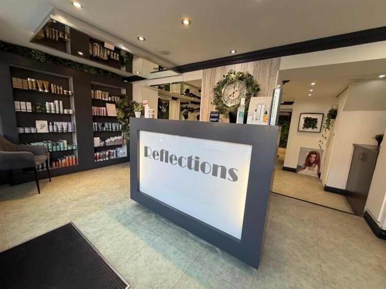 An extended two-storey retail premises located in the town centre, let to reflections hair salon at £32,000 per annum on a 10-year fully repairin Photo 4