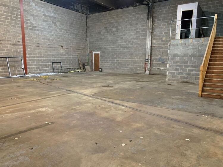 An industrial unit of approximately 2,500 ft² located within the printworks development which is currently undergoing significant redevelopment. Photo 4