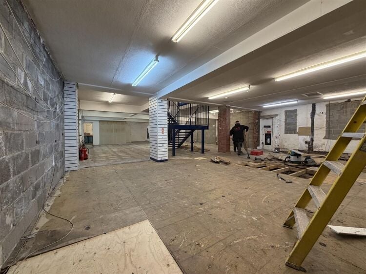 The property comprises a substantial retail unit extending to approximately 4,912 sq ft, arranged over ground and first floors. Photo 4