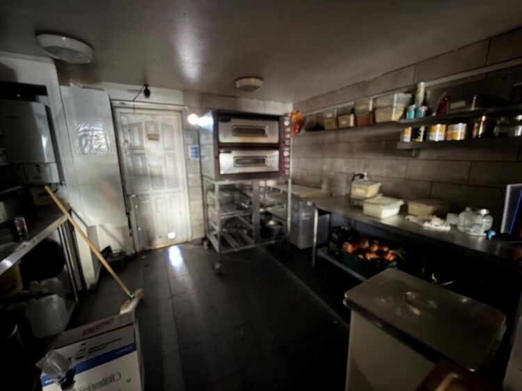 A mid terrace takeaway, of approximately 600 ft², with commercial extraction and additional first floor ancillary storage (of approx. 350 ft² Photo 4