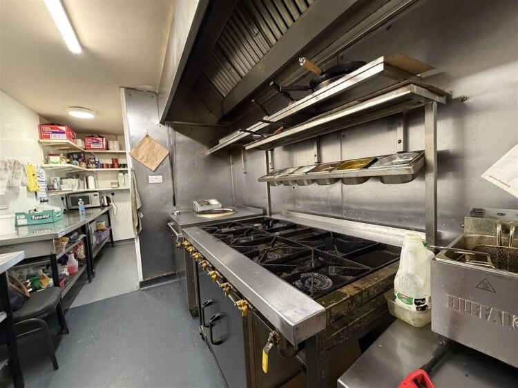 A fully fitted takeaway premises extending to approximately 876 sq ft. Photo 4