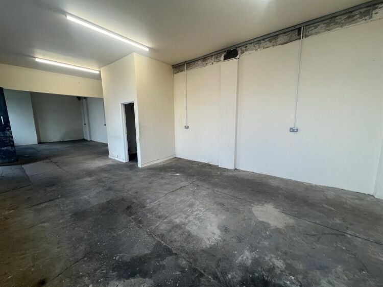 A ground floor workshop/store of approximately 760 ft² / 71m² with wc. the unit benefits from double doors and windows to the front. a furth Photo 5