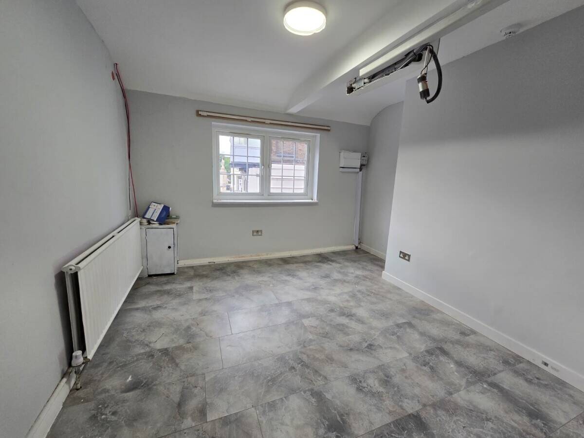 Mixed-use freehold property for sale on Staines High Street in Staines upon Thames Surrey Photo 1
