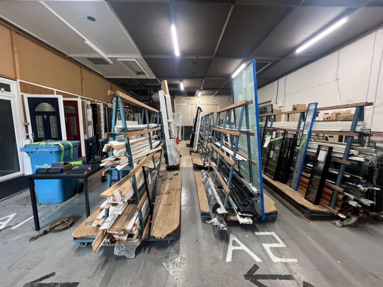 A large showroom of approximately 5,340 ft² with forecourt parking and a large, enclosed yard to the rear. the unit is situated in mangotsfield, Photo 5