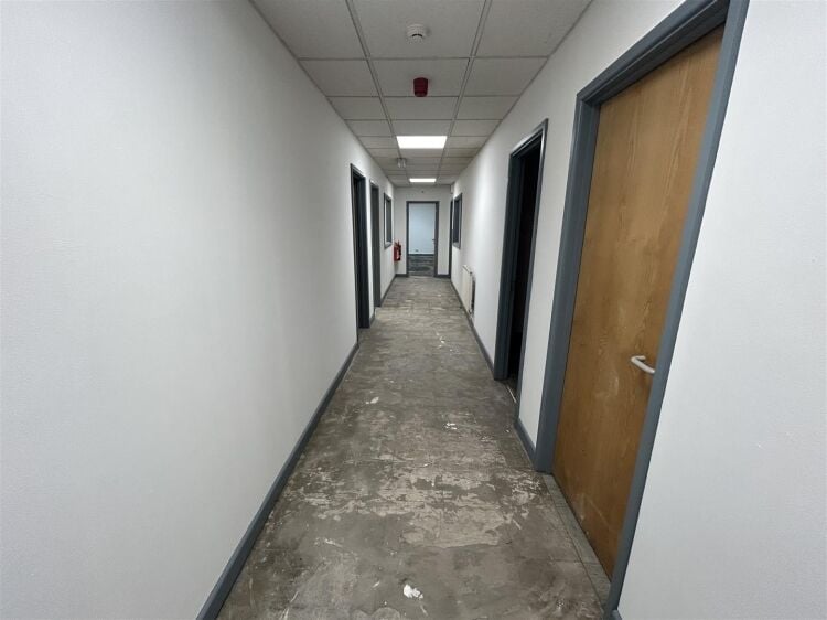 A ground floor office of approx 1,500 ft² with additional toilet facilities. the property benefits from allocated parking, security shutters, and Photo 5